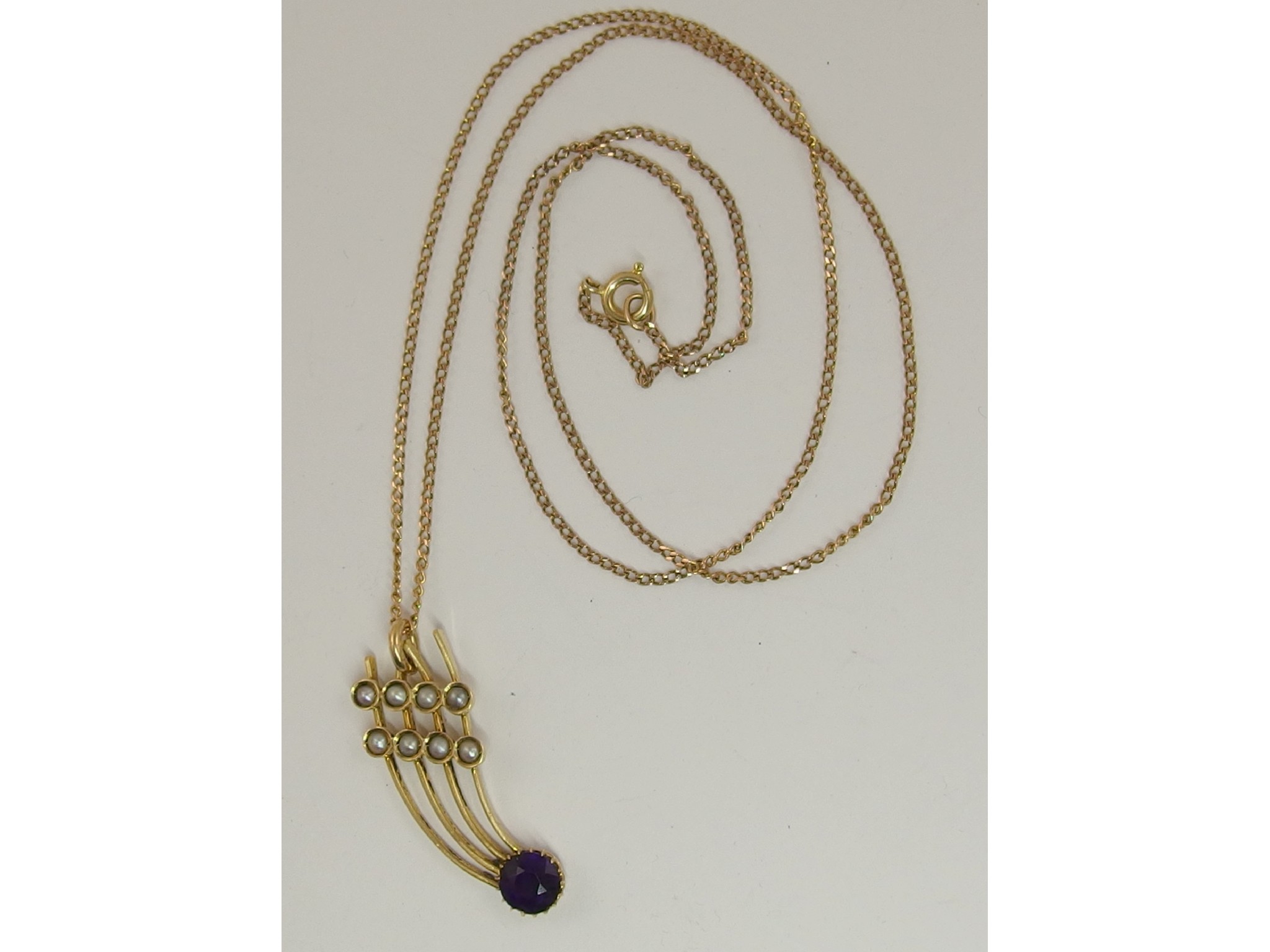 Appraisal: A ct amethyst and pearl comet shaped pendant and ct