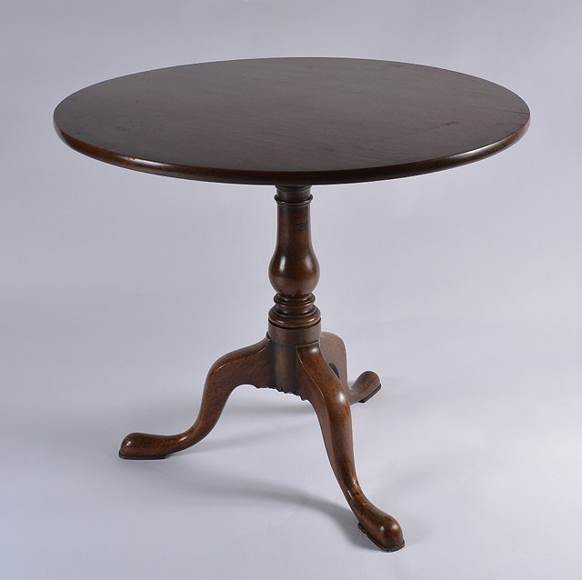 Appraisal: An early th Century oak tripod tablewith circular tilt-top on