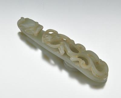 Appraisal: A Carved Jade Ornamental Belt Hook Chinese Traditional form carved