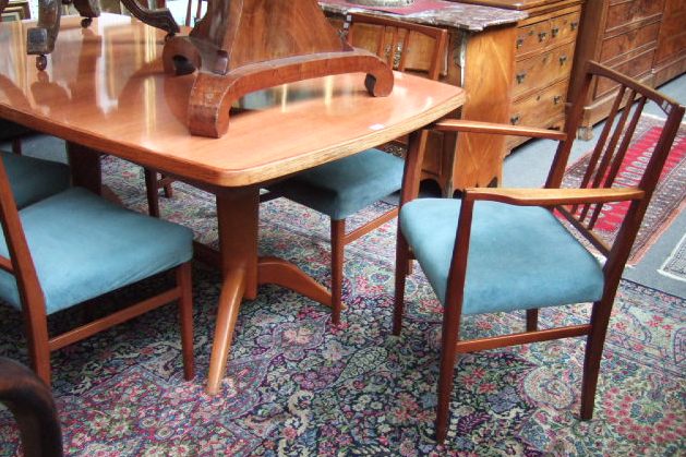 Appraisal: A Gordon Russell rosewood dining table and six chairs cm