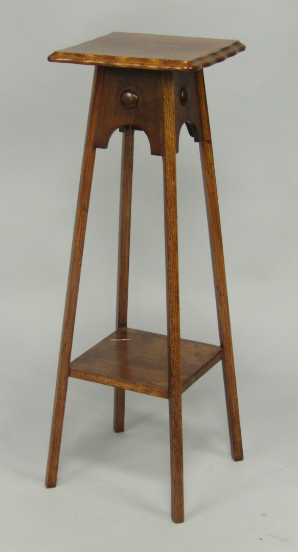 Appraisal: An oak jardiniere stand early thC the square top raised