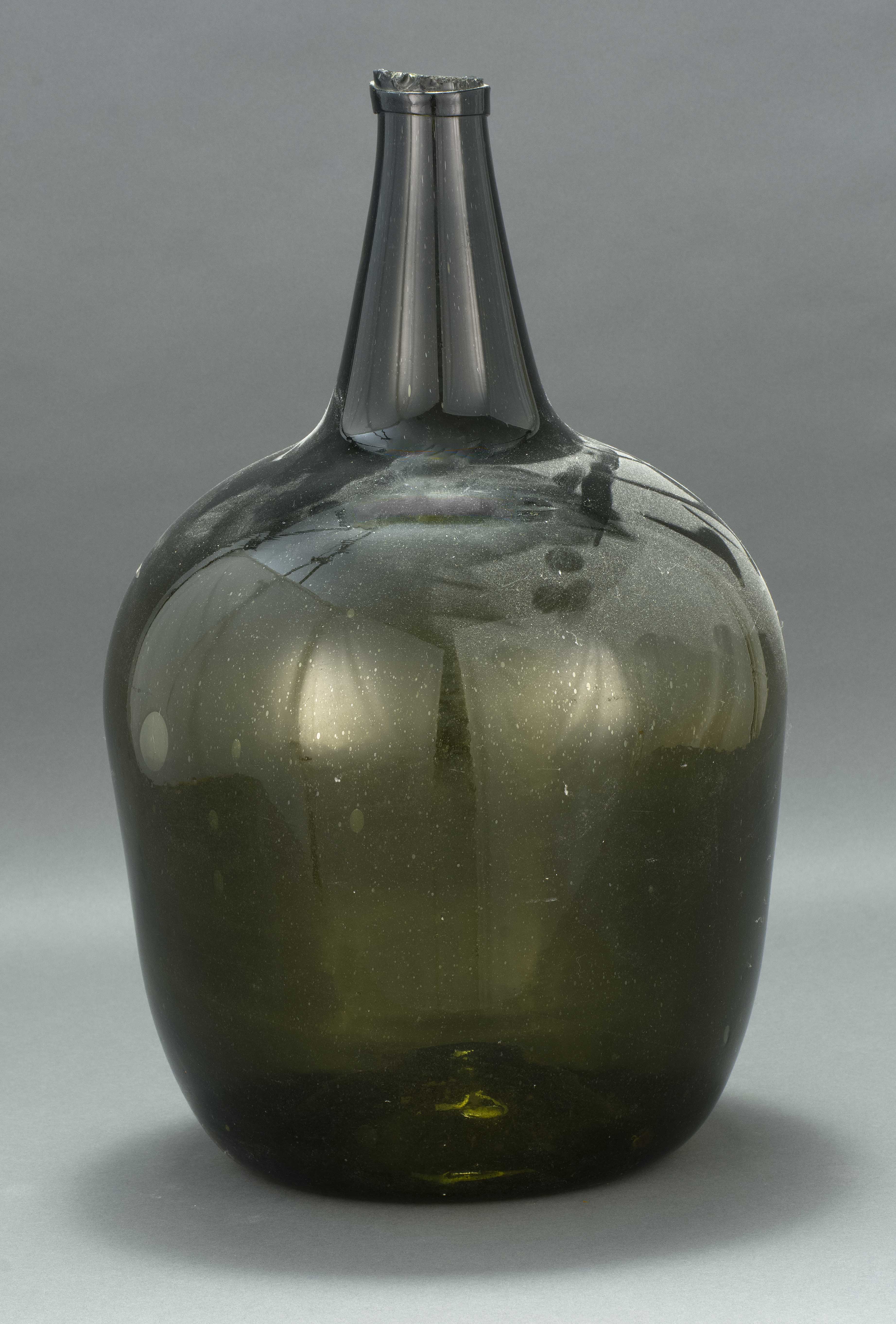 Appraisal: BLOWN GLASS DEMIJOHN th CenturyIn olive green Height ConditionHeavy tooling