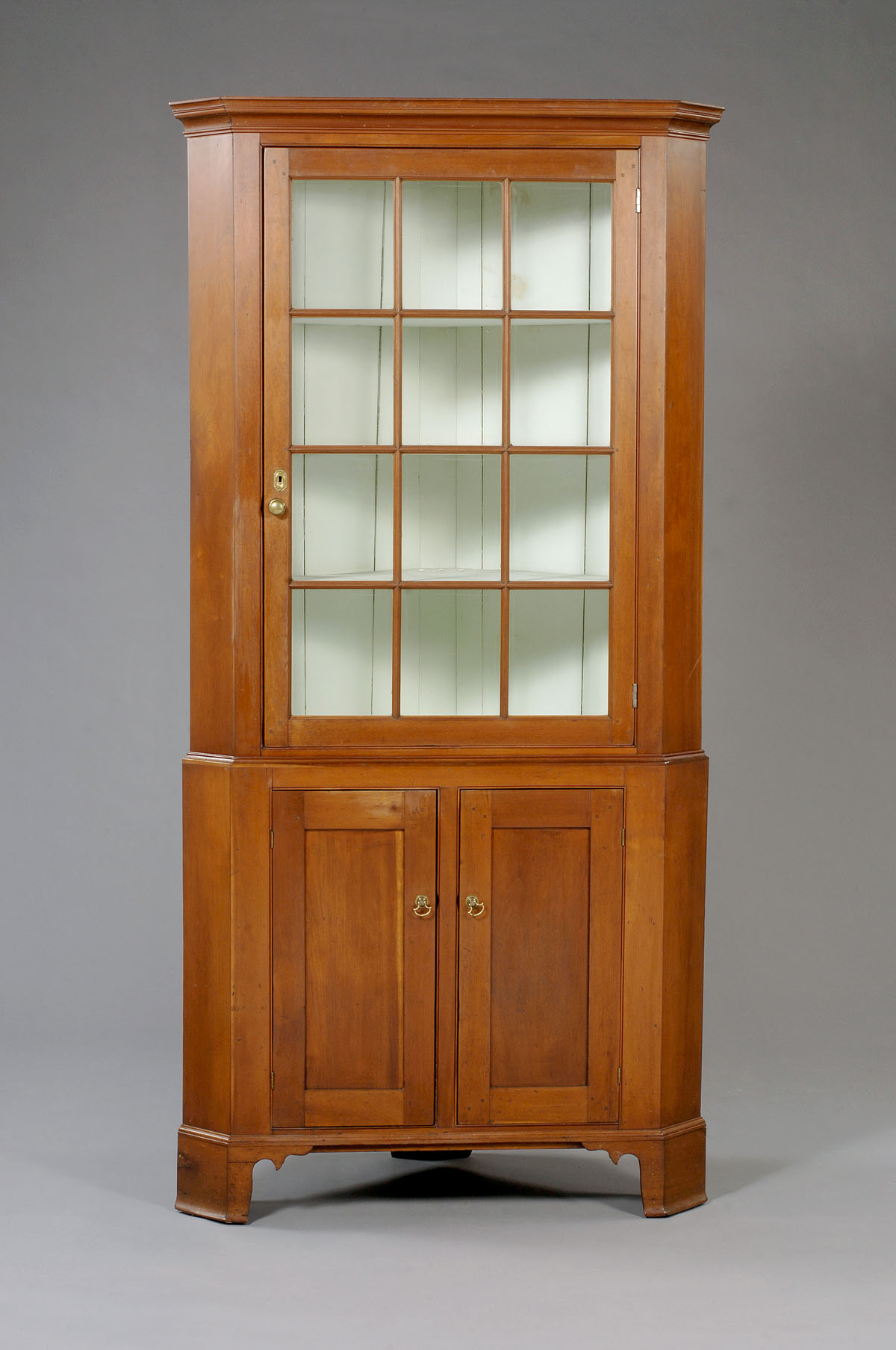 Appraisal: CONNECTICUT CHIPPENDALE CHERRY CORNER CUPBOARD In two parts the cove