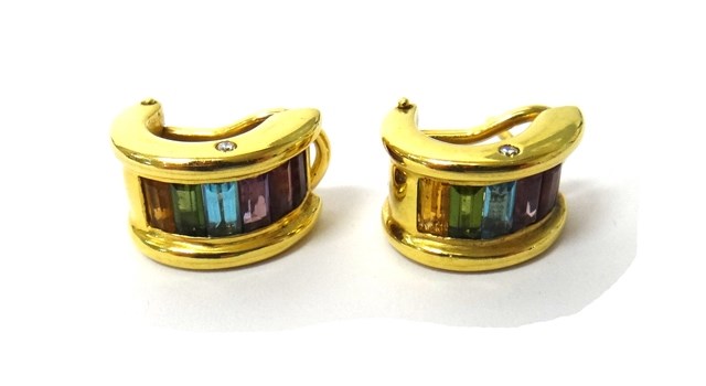 Appraisal: A pair of gold and vary coloured gemstone set earclips