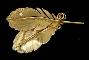 Appraisal: A Lovely Feather Brooch with a Diamond k yellow gold