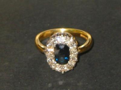 Appraisal: A SAPPHIRE AND DIAMOND CLUSTER RING the oval cut sapphire