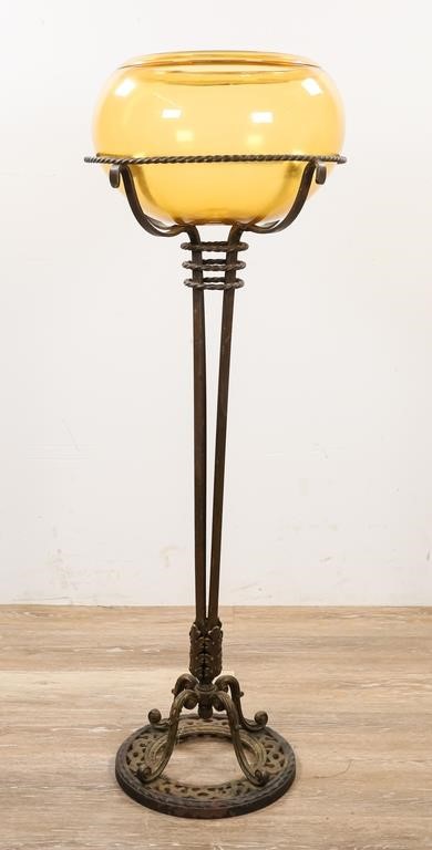 Appraisal: Victorian iron stand with amber fish bowl Stand H x