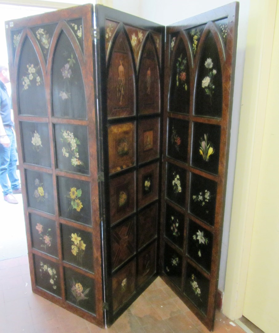 Appraisal: A Victorian oak framed three fold draft screen with Gothic