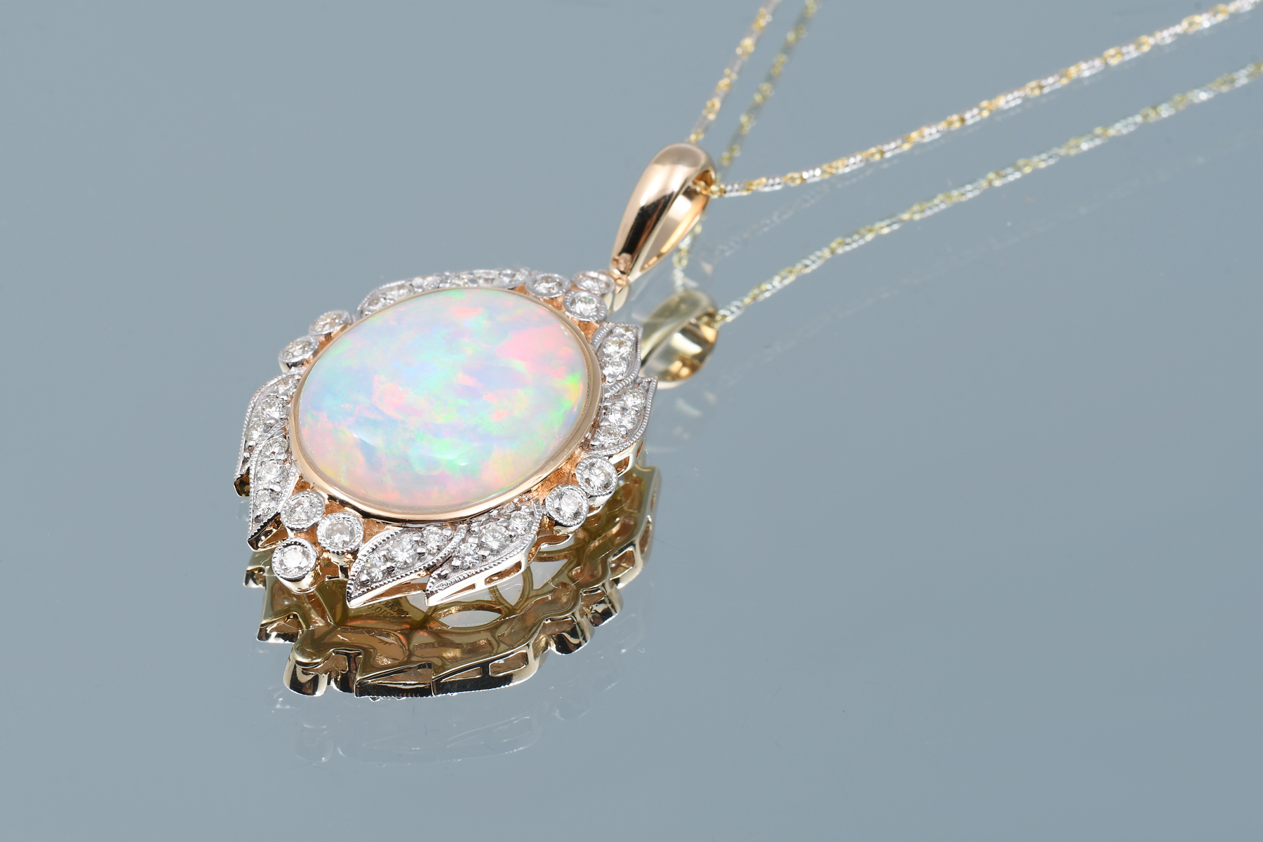 Appraisal: K FIERY CT OPAL DIAMOND NECKLACE Beautiful fiery CT oval