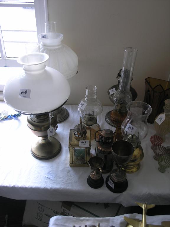 Appraisal: An assortment of oil lamps a variety two silver plated