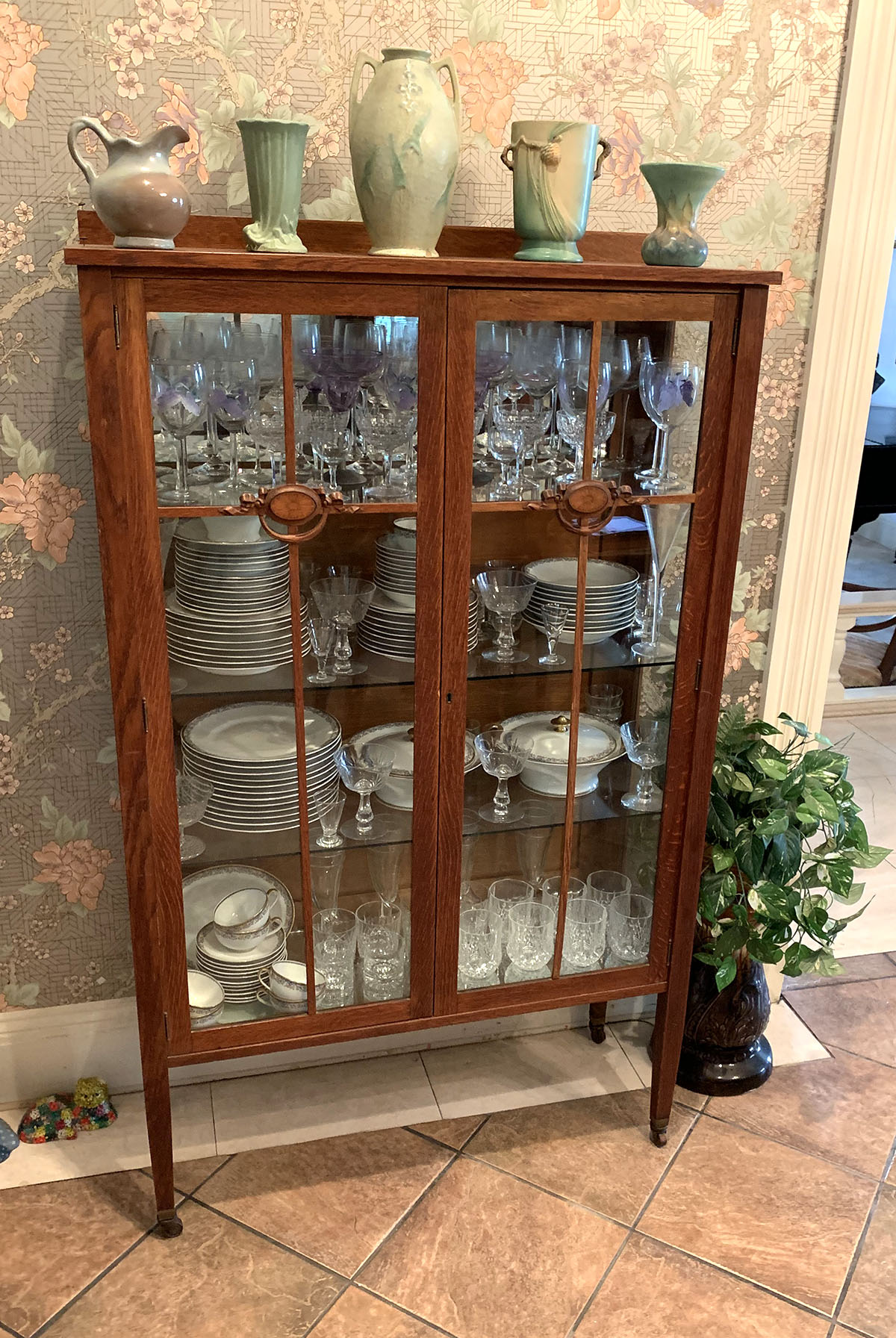 Appraisal: AMERICAN OAK BOOKCASE Oak bookcase having glass front doors each