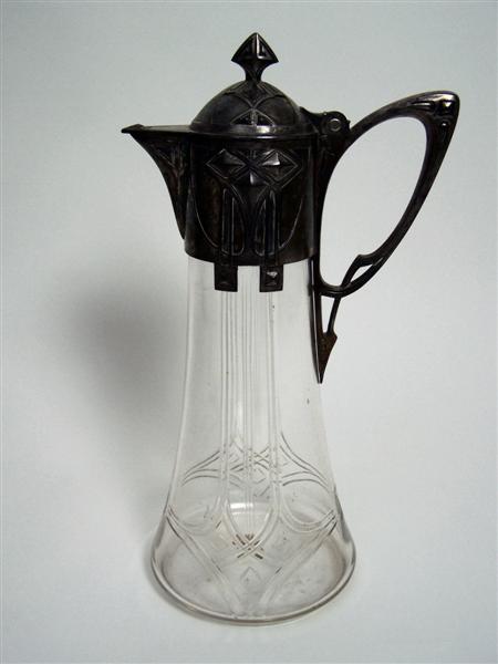 Appraisal: WMF CLARET JUG CIRCA cut clear glass with electroplate mounts