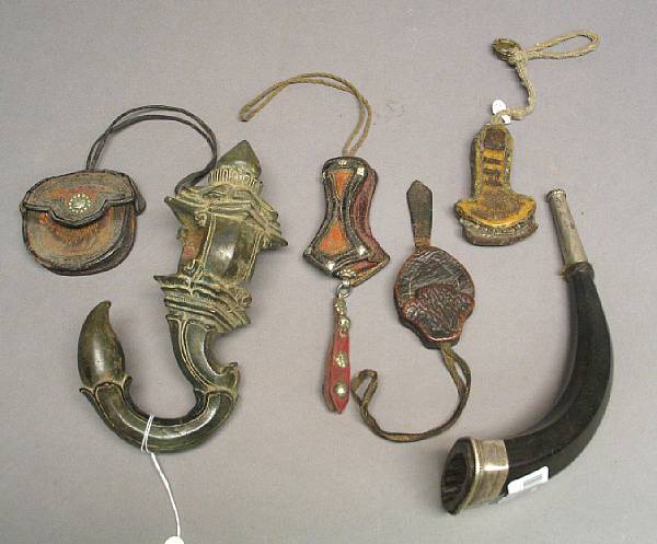 Appraisal: A group of Asian decorations Including four Tibetan leather needle