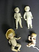 Appraisal: FOUR GERMAN ALL BISQUE TINY DOLLS Each different piece jointed