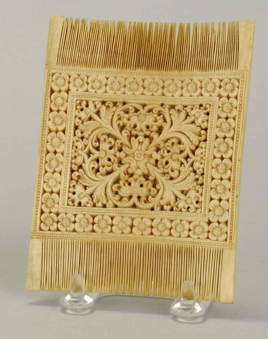 Appraisal: ELABORATELY CARVED IVORY DOUBLE-SIDED COMBProbably Indian Late th Early th