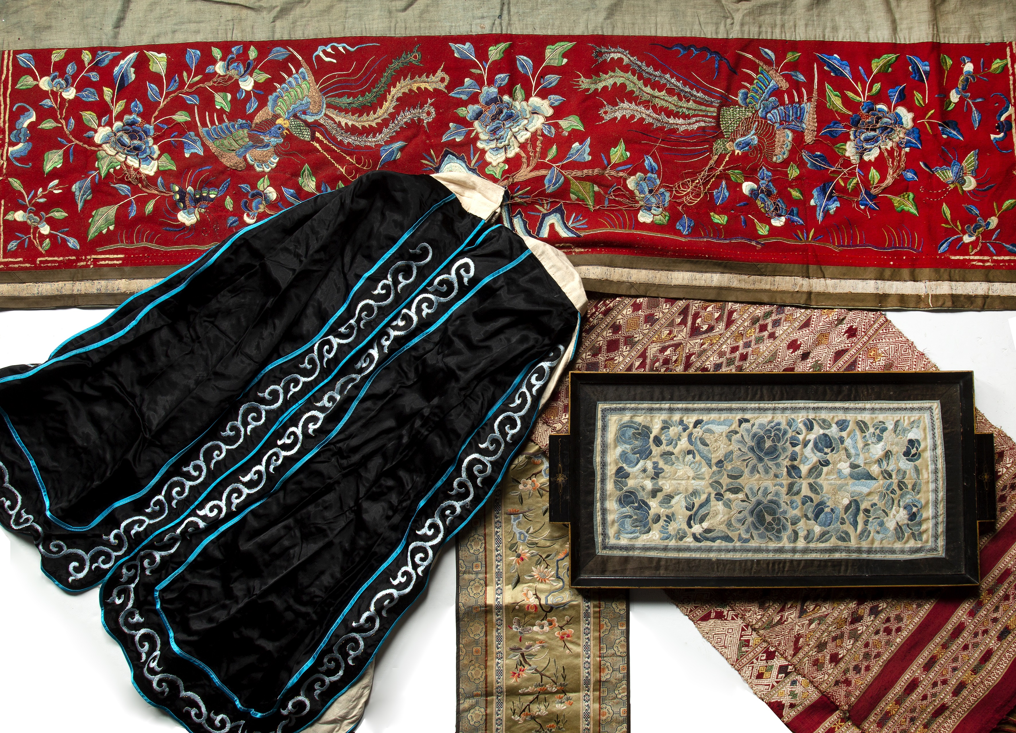 Appraisal: Group of textilesChinese including a black ground skirt a red