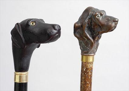 Appraisal: TWO HOUND HEAD WALKING STICKS The one plated with brass