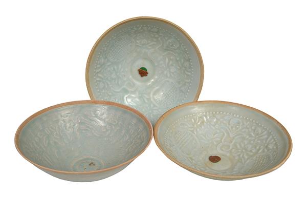 Appraisal: A GROUP OF THREE CHINESE QINGBAI CONICAL BOWLS with lightly