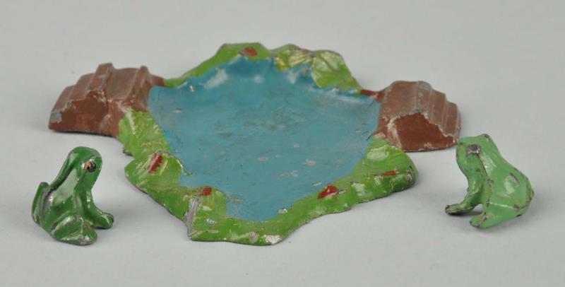 Appraisal: Diecast Britains Frog Pond With Frogs Includes two separate frogs