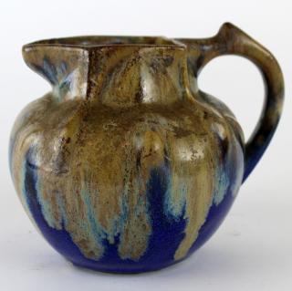 Appraisal: French Dieulefit glazed pottery pitcher French Dieuleft glazed pottery small