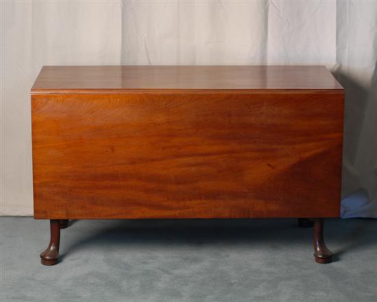 Appraisal: An Early Walnut Deep-drop Dining Table with tall turned and