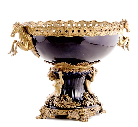 Appraisal: French style metal-mounted porcelain centerpiece ovoid form flanked by horse