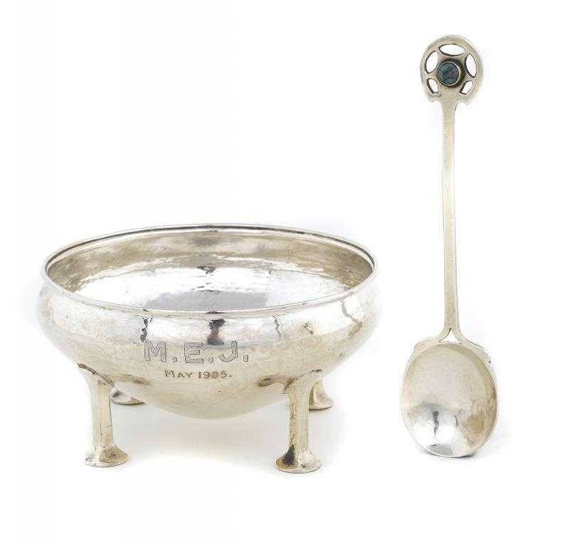 Appraisal: AN A E JONES SILVER PORRINGER AND SPOON the lightly