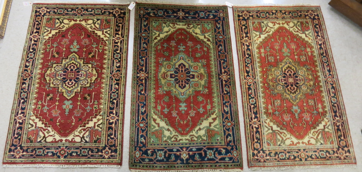 Appraisal: THREE SIMILAR HAND KNOTTED ORIENTAL AREA RUGS all Persian Serapi