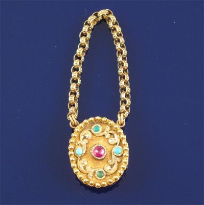 Appraisal: A Regency two colour gold oval locket pendant Centred with