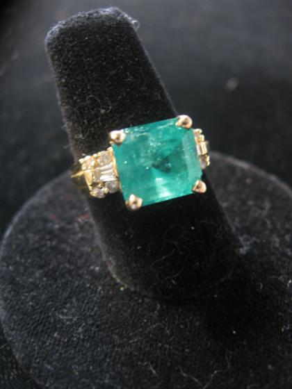 Appraisal: karat yellow gold emerald and diamond ring Square step cut