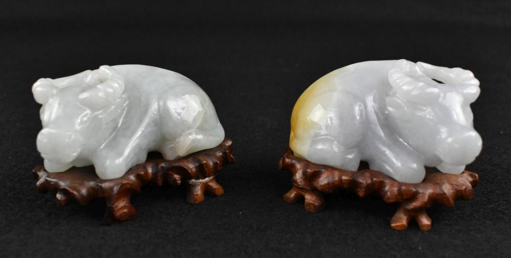 Appraisal: PAIR OF CHINESE JADEITE BUFFALOEach in a recumbent pose both