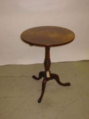 Appraisal: A GEORGE III MAHOGANY TRIPOD TABLE the circular tip up