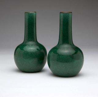 Appraisal: A pair of Chinese apple green crackle th century each