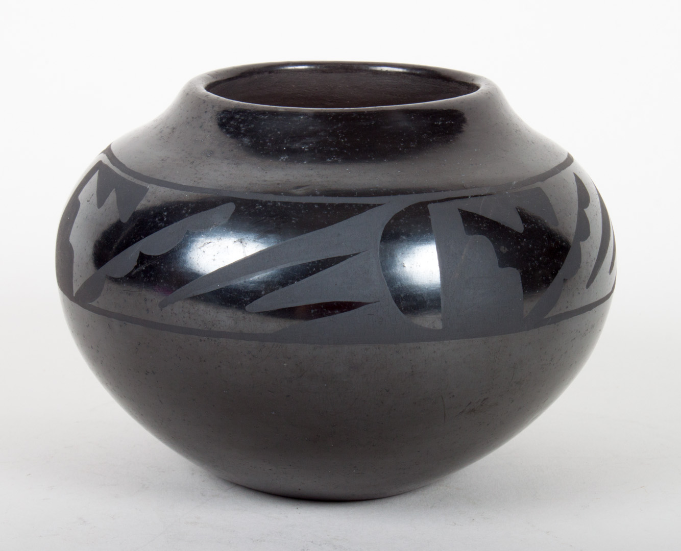 Appraisal: San Ildefonso blackware pot with geometric pattern band signed Santana