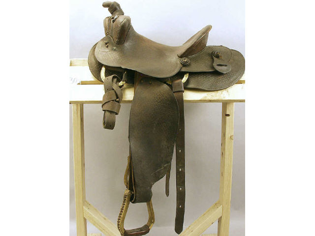 Appraisal: Early round skirted double rigged Western saddle by N Porter