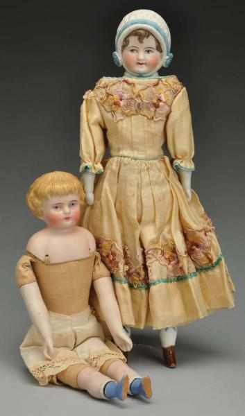 Appraisal: Lot of German Bisque Shoulder Head Dolls Description Unusual head