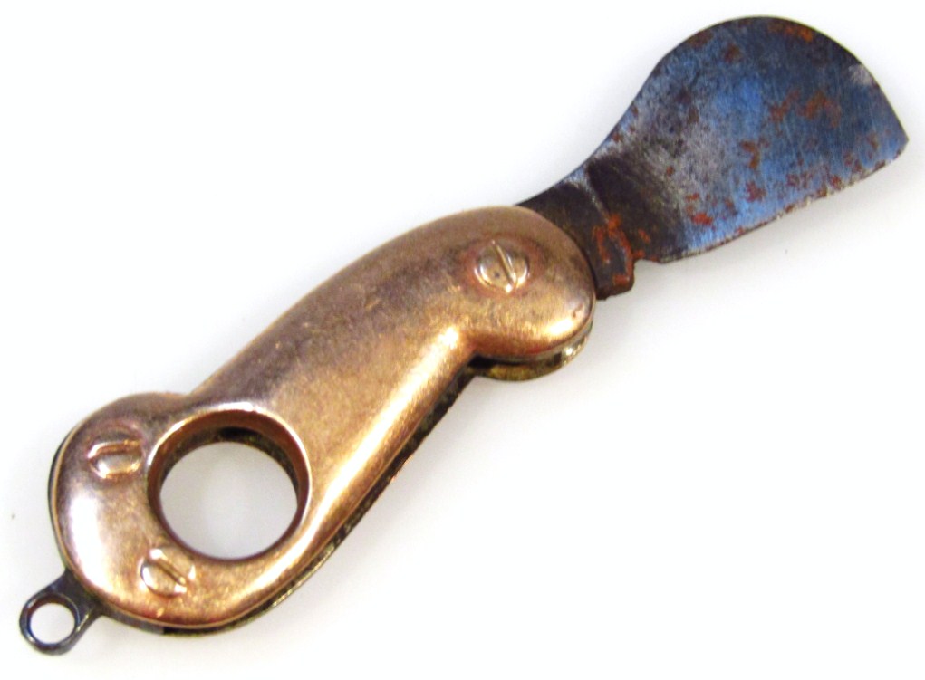 Appraisal: A cigar cutter fob of shaped outline with yellow metal