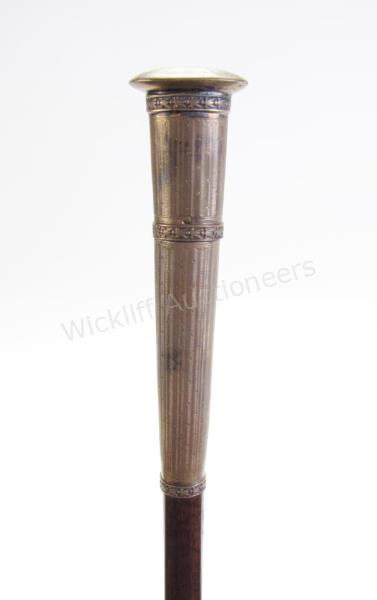 Appraisal: Manicurist Cane solid snakewood shaft silver guilt handle which opens