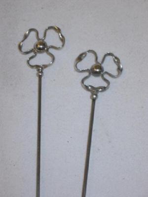 Appraisal: A PAIR OF CHARLES HORNER SILVER HAT PINS modelled as