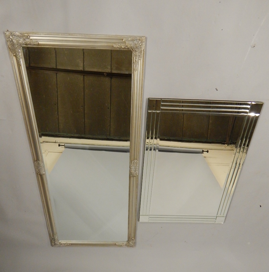 Appraisal: A silvered wall mirror with a bevelled plate cm x