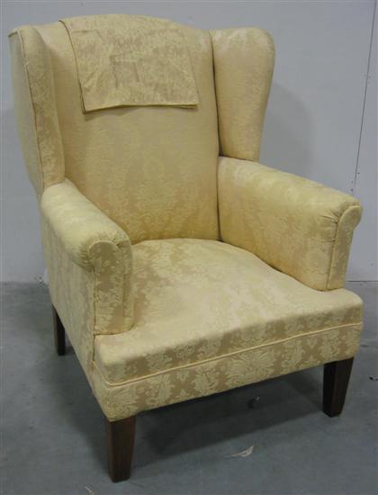 Appraisal: Yellow upholstered wing chair H in W in D in