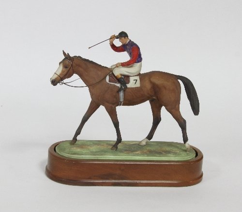 Appraisal: A Royal Worcester equestrian figure ''The Winner'' the jockey wearing