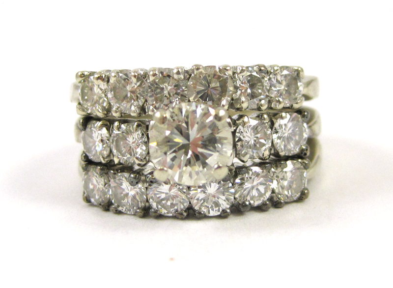 Appraisal: DIAMOND AND FOURTEEN KARAT WHITE GOLD RING with round-cut diamonds