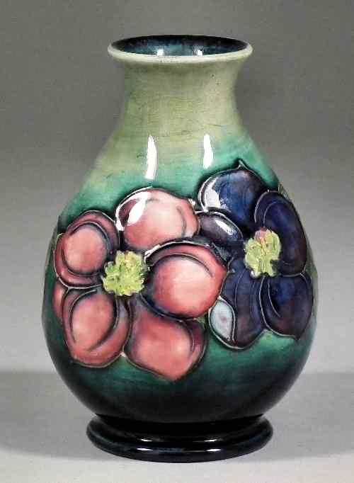 Appraisal: A Moorcroft pottery bulbous bud vase tube lined and decorated