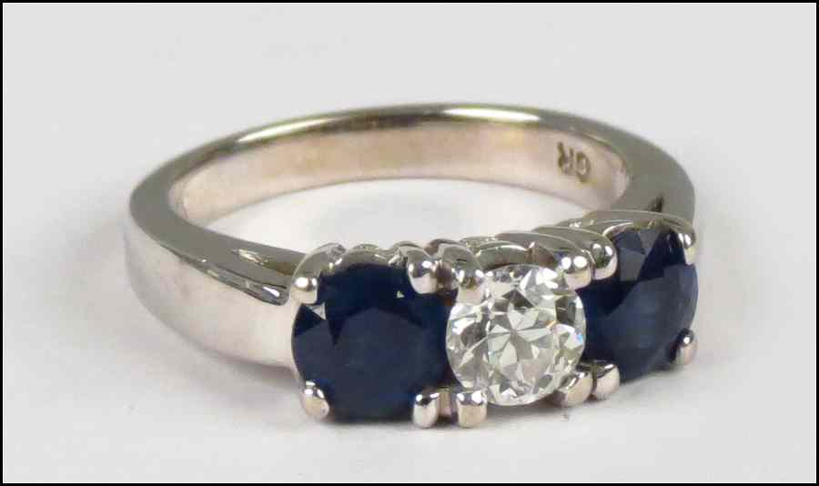 Appraisal: SAPPHIRE DIAMOND AND KARAT WHITE GOLD RING Central diamond is