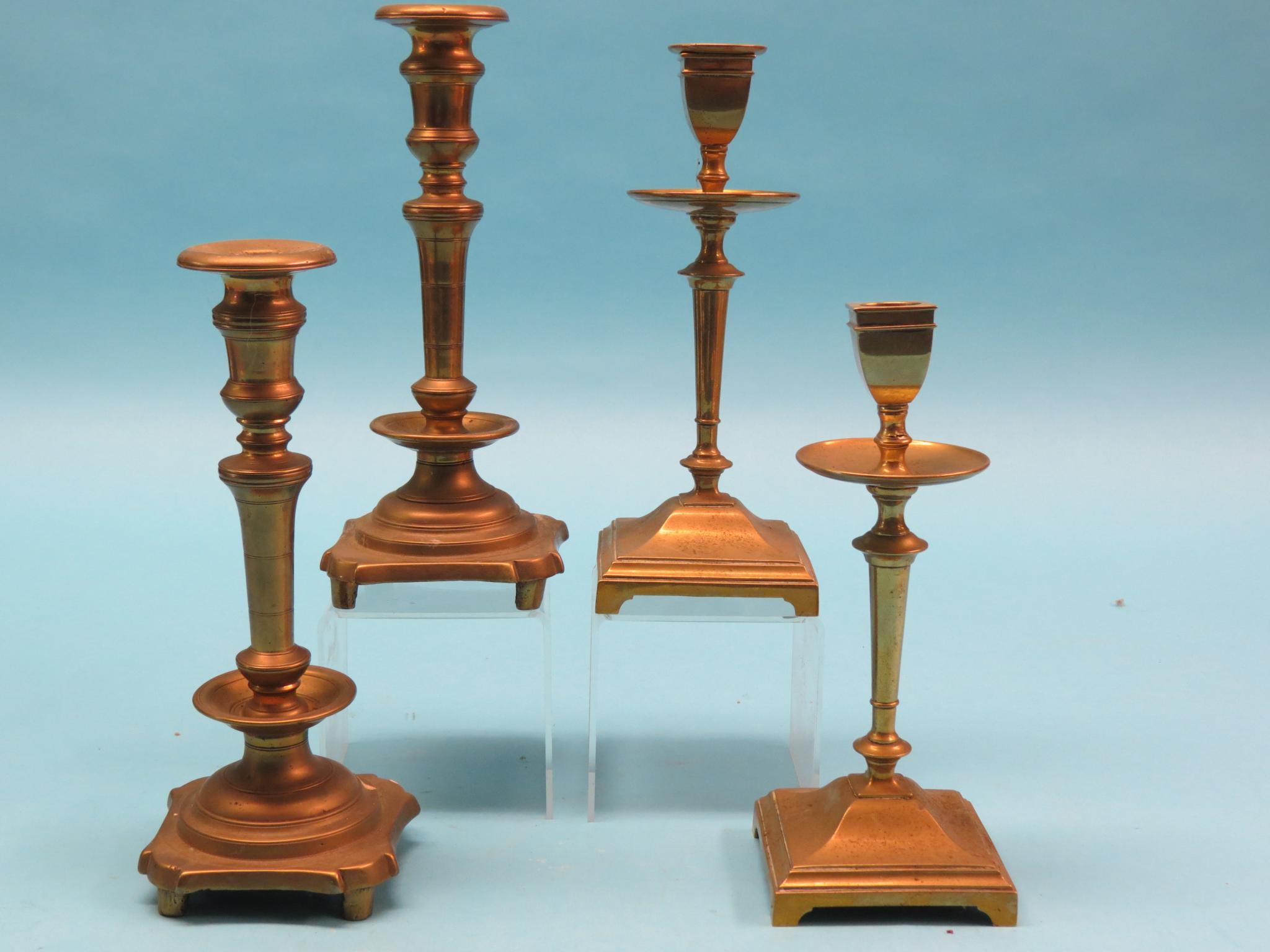 Appraisal: A pair of th century bronze candlesticks baluster-stems with drip-trays