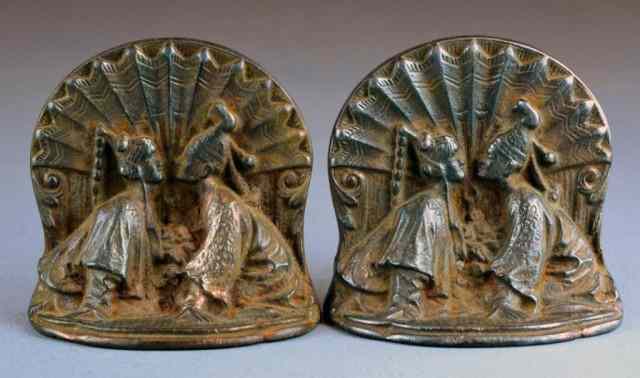 Appraisal: Pair Oriental Cast Iron BookendsCast Iron bookends with loving couple