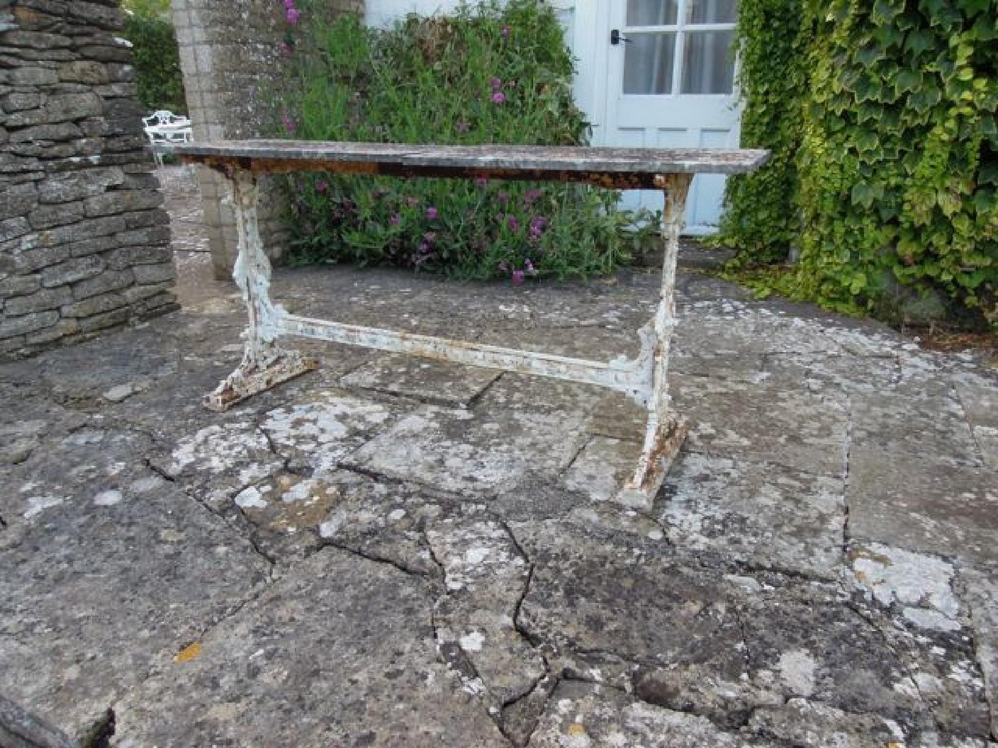 Appraisal: A Victorian cast iron garden table rectangular with geometric detail