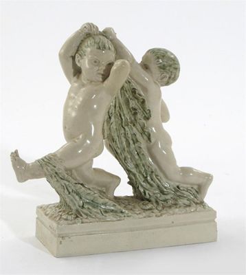 Appraisal: A Joyce Bidder pottery figure of two putti modelled playing