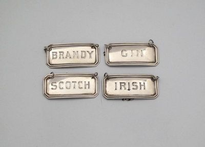 Appraisal: A set of four Edwardian Irish silver wine labels by